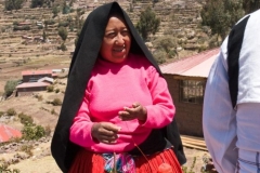 Taquile Woman in Traditional Dress Spinning Yarn